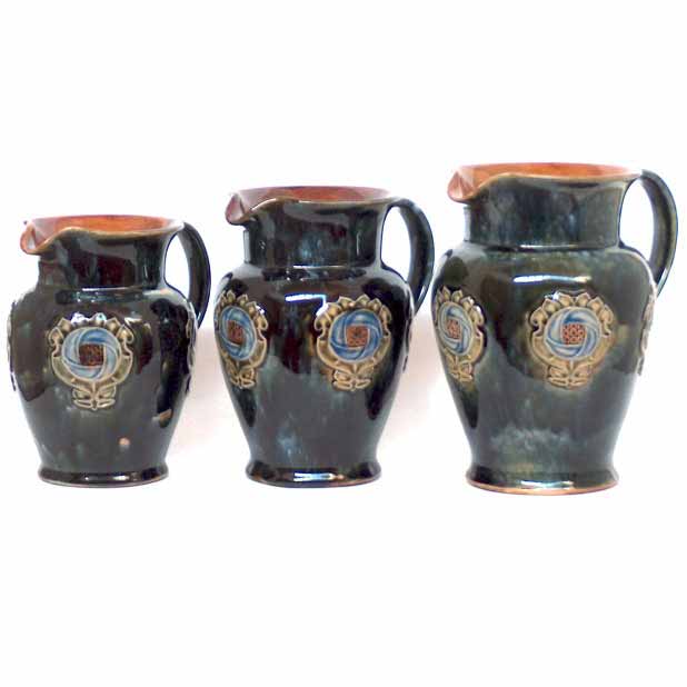 A set of  three Royal Doulton Art Nouveau Jugs