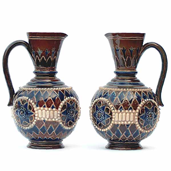 A pair of Doulton Lambeth Ewers