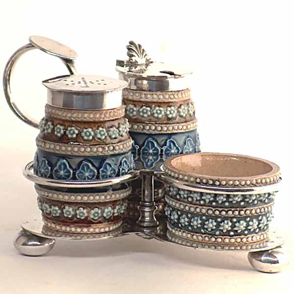 An exquisite Doulton Lambeth cruet set by Emily Maine