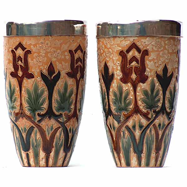 A pair of 5.5in (13.5cm) Doulton Lambeth beakers by Frank Butler