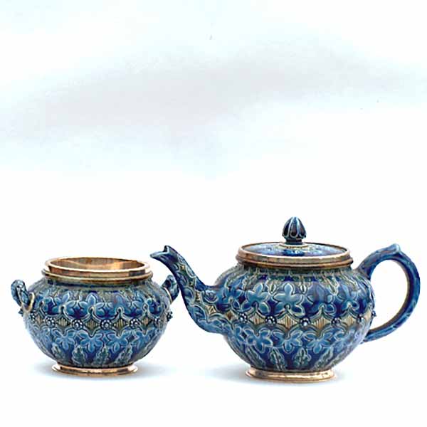 A Doulton Lambeth tea pot and sugar basin by Frank A Butler - 708 & 709