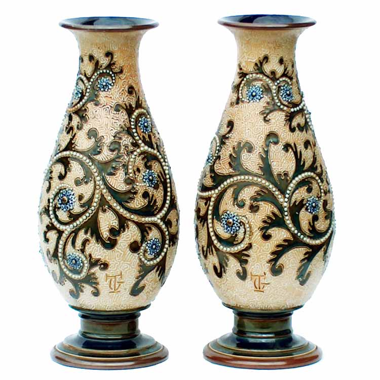George Tinworth - A Royal Doulton 1903 pair of 32.5cm (13.25in) vases