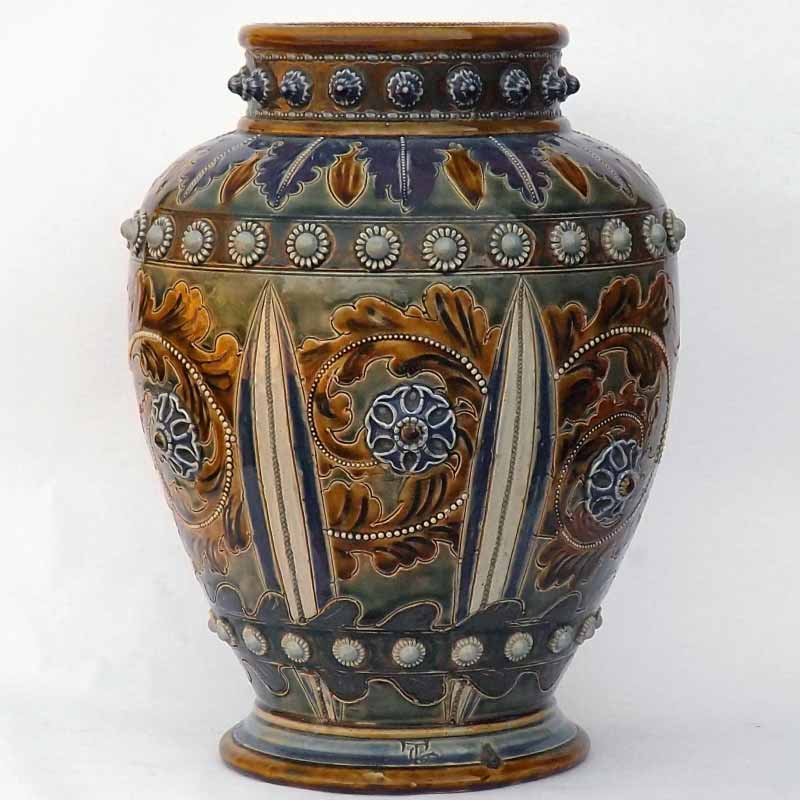 An 11.5in (29cm) Doulton Lambeth vase by George Tinworth