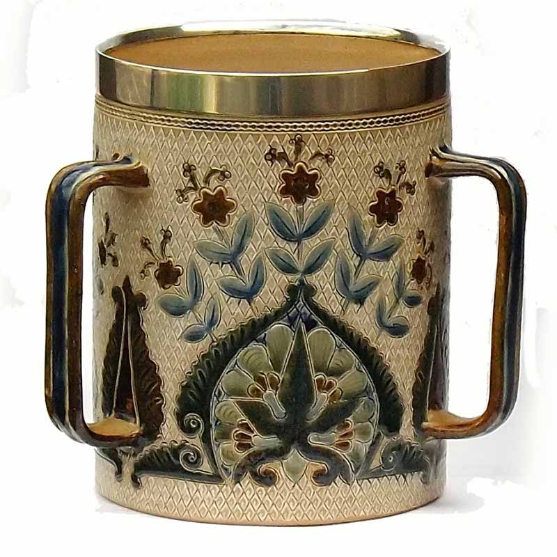 William Parker - a 7.25in (18cm) Doulton Lambeth tyg with silver rim - 261